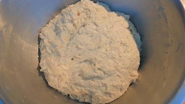 Raw bread dough in a bowl.