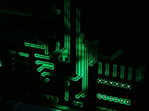 A green circuit board on a black background