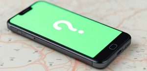 Green phone on map with question mark