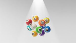 A photograph of a collection of vibrant lottery balls suspended against a stark white background. Second largest Powerball jackpot claimed, amounting to $1.787 billion