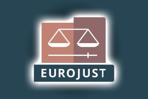 Eurojust charges two over €1 billion illegal online casino ring. Eurojust logo on dark blue background