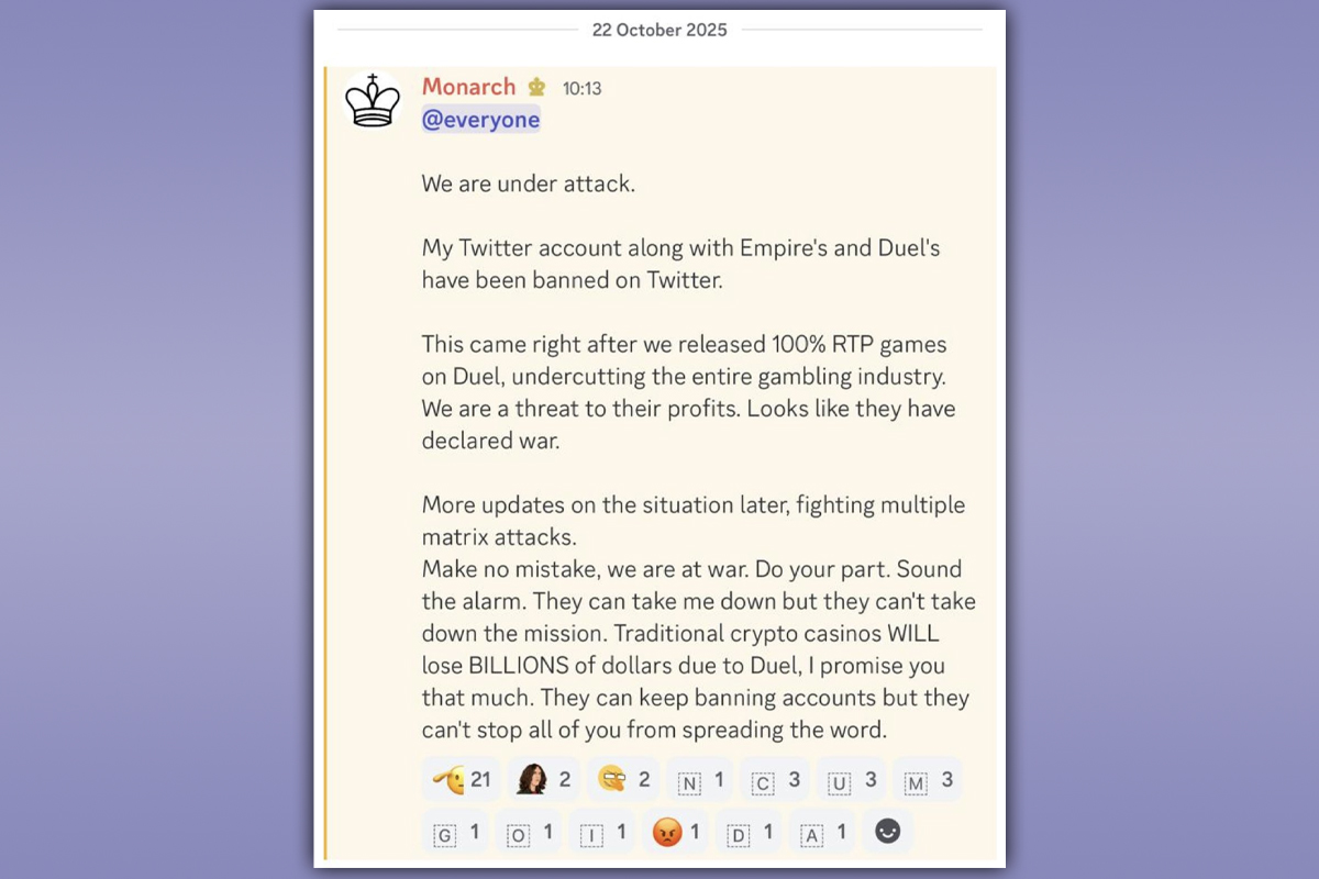 Screenshot of a Discord message from a user named Monarch dated October 22, 2025. Monarch announces that their Twitter account and those of Empire and Duel have been banned, claiming they are under attack and referring to "fighting multiple matrix attacks." The message frames the bans as retaliation for releasing 100% RTP games on Duel and calls followers to action.