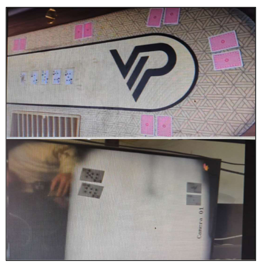 Two images: the top shows a poker table with face-down and face-up cards arranged around it. The table has a patterned surface and a large VP logo in the center. The bottom image shows a grayscale camera feed displaying several playing cards on a screen labeled “Camera 01.” This is allegedly part of the NBA rigger poker scandal.