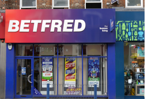 Outside of a Betfred shop: Blue painting, Betfred logo on the sign. Betfred co-founder warns UK gambling tax rise could shut all shops. Betfred has now been hit with a fine by the Gambling Commission
