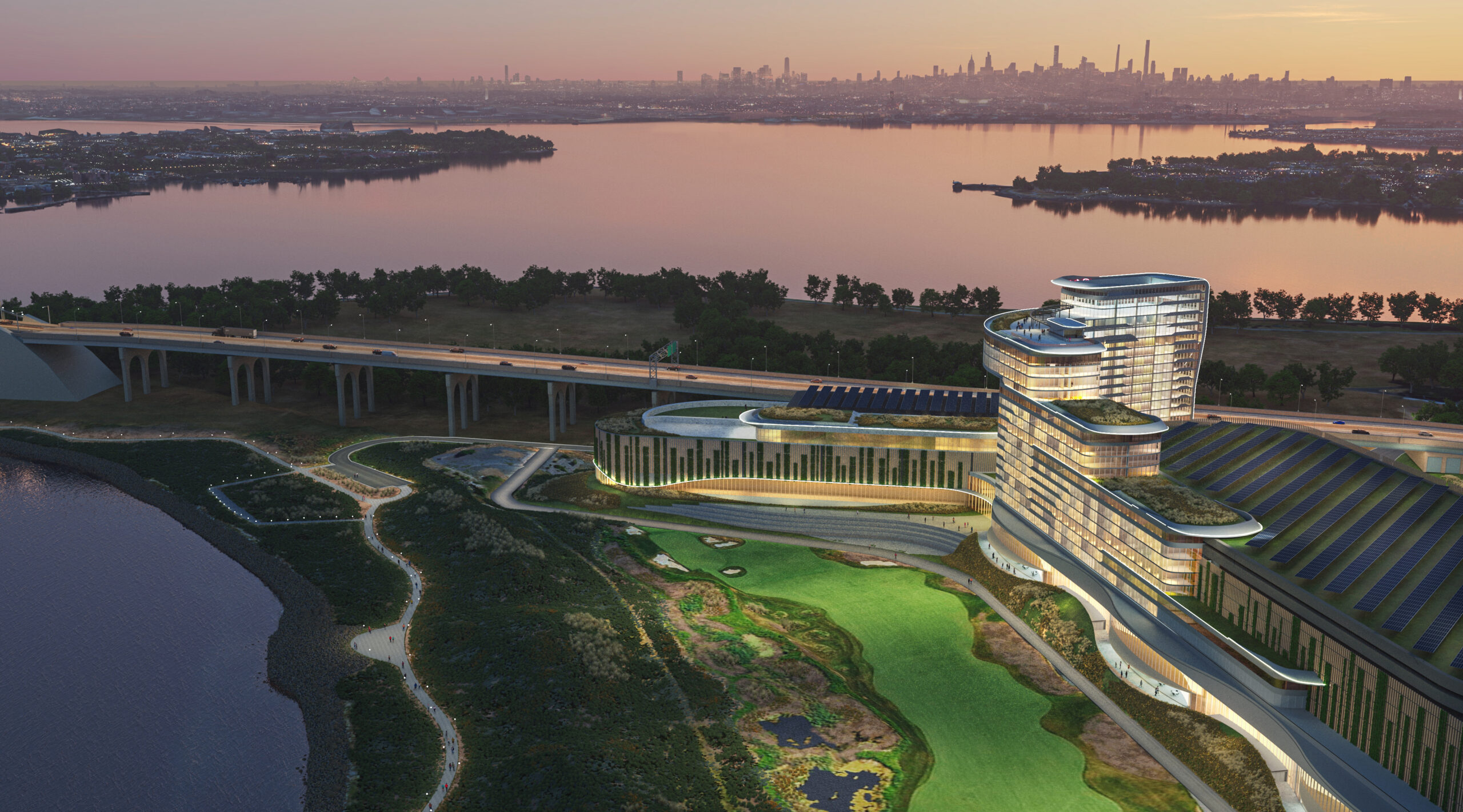 Rendering of Bally’s proposed casino in the Bronx at Ferry Point Park, showing a modern hotel and casino complex overlooking water at sunset.