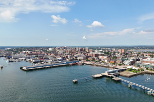 Aerial view of Portland, Maine's skyline, buildings in the background. Campaign for Fairer Gambling criticizes Maine governor over online casino approval