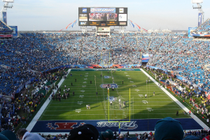 SuperBowl event, wide view of the stadium, with people on the pitch and fans filling up the seats. FanDuel and DraftKings prediction markets could offer Super Bowl parlays, as CME issues self-certification